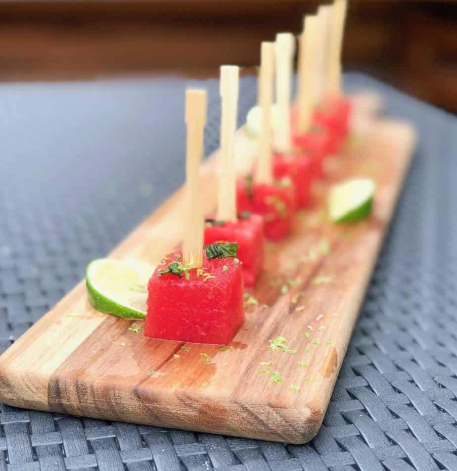 watermelon mojito skewers appetizer on a wooden plank.
