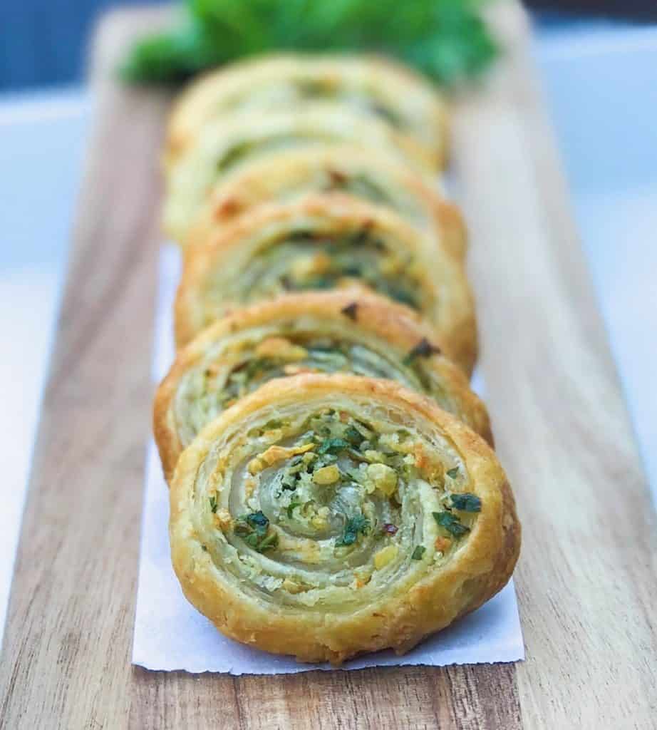 Puff Pastry pinwheels with garlic and herbs on platter