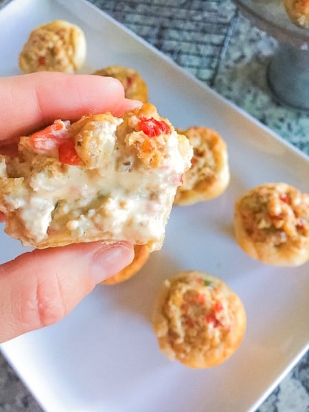 sausage stuffed biscuits with cheese oozing out.