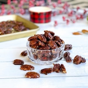 glazed pecans in a glass bowl: a holiday finger food snack