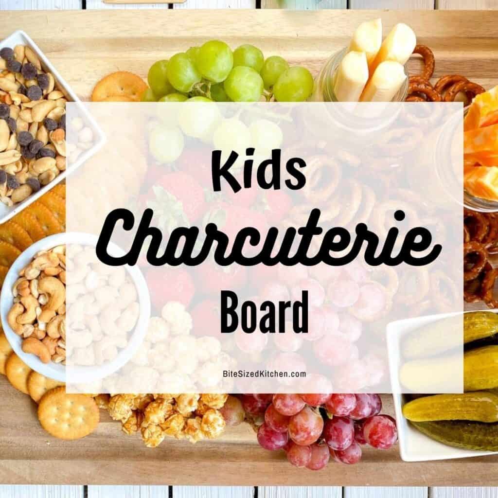 kid friendly charcuterie platter with snacks, fruits and cheese with overlay "kids charcuterie board"