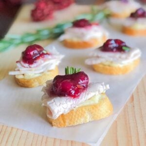 leftover Thanksgiving turkey crostini with cranberry sauce and brie cheese