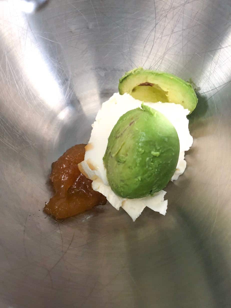 Avocado cream cheese and honey in a bow.