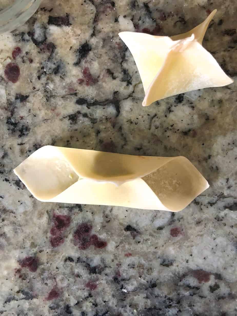 Folding wontons.