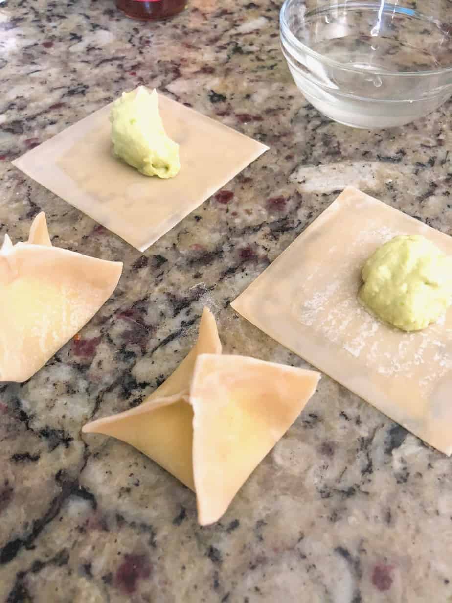 Wontons filled with avocado filling.