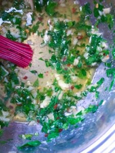 garlic herb oil in saucepan
