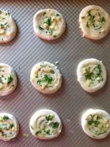 puff pastry pinwheels brushed with garlic herb oil on a baking sheet