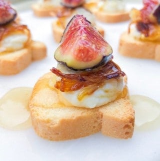 These Mini Canapé Toasts With Sweet Cheese are one of the best canapes you can make for your next party! Made with a mixture of brie cheese, goat cheese, caramelized onions and honey. The figs are optional! Just whip up the filling ahead of time and top them when guests arrive for a delicious hors d'œuvre!