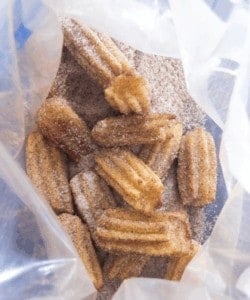 Baked churros with cinnamon and sugar.