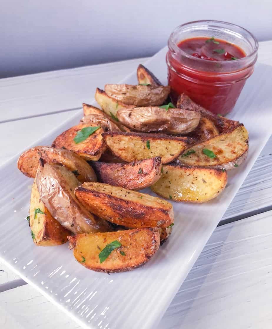 Potato wedges on plate.