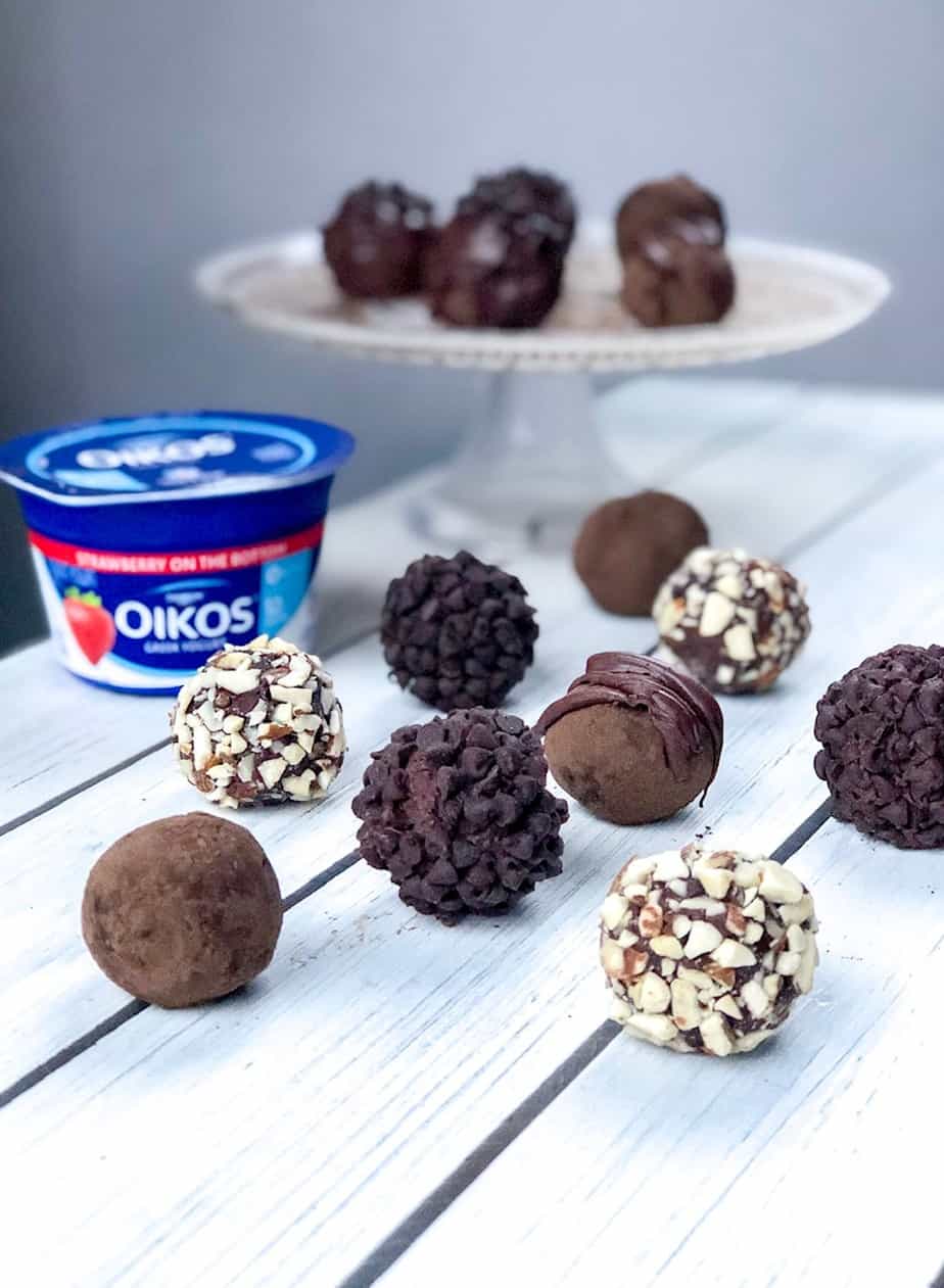 These chocolate strawberry yogurt balls are just like a creamy Truffle but a healthy version! Perfect for Valentines day OR a indulgent way to satisfy your sweet tooth post meals. Easy and bite sized! #valentinesday #chocolatetruffles #yogurt #easydesserts
