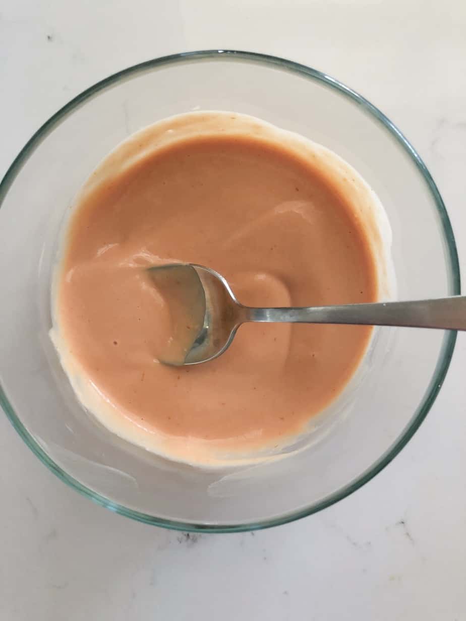 The best burger sauce recipe in a bowl with a spoon.