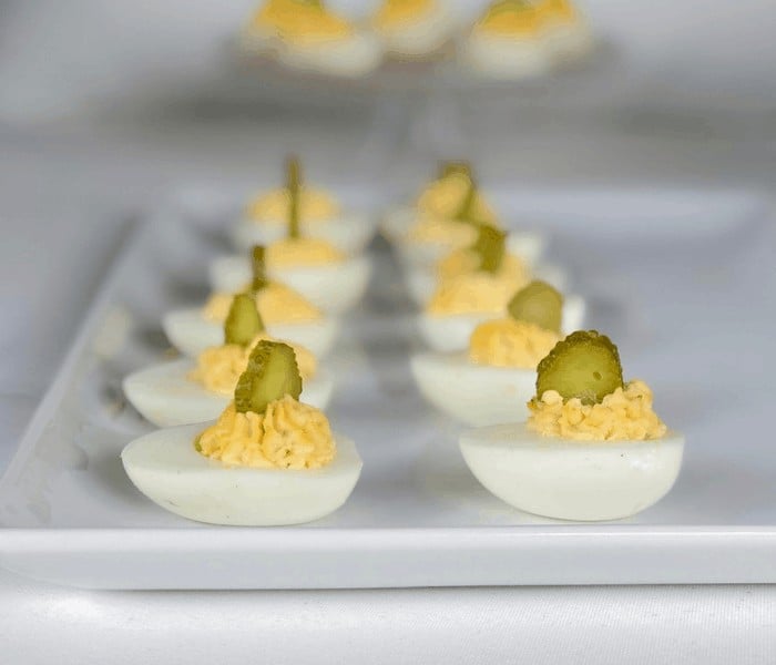 Southern deviled eggs on white plate.