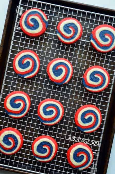 Red white and blue icebox cookies on a cooling rack.