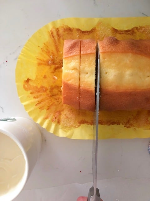 Slicing a pound cake.