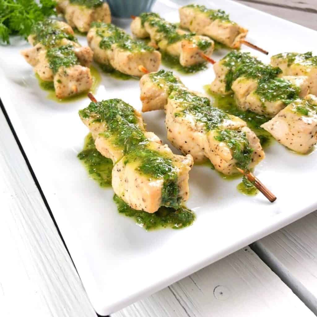 baked chicken kabobs on a plate.