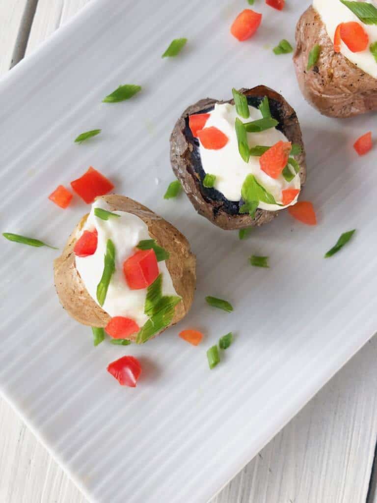 mini baked potatoes on a plate for any party.