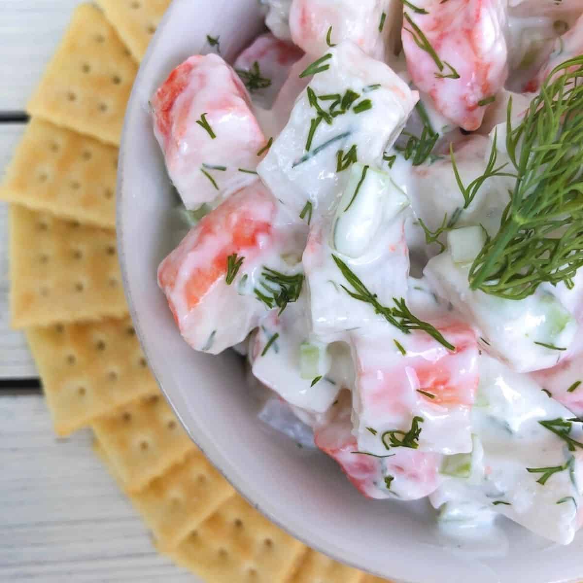 Imitation crab meat salad with crackers.