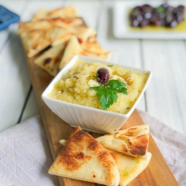 Skordalia in a bowl served with pita bread.