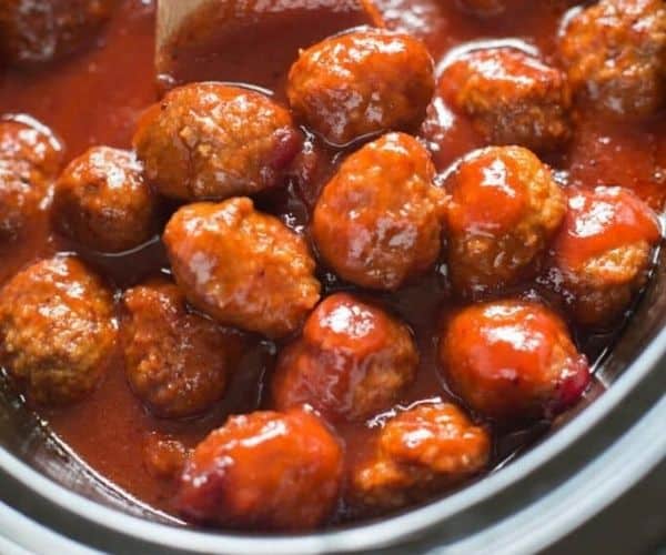 Cranberry BBQ meatballs in a slow cooker.