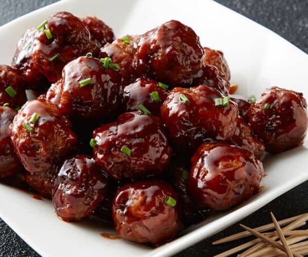 BBQ meatballs in a white bowl.