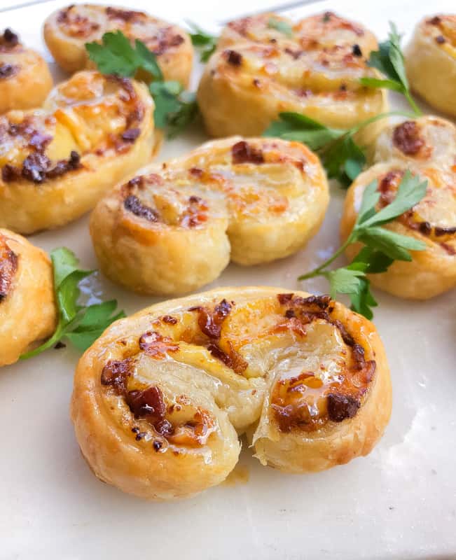 Puff pastry palmiers stuffed with bacon and cheese.