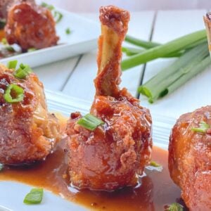 chicken drumsticks frenched into lollipops with sauce