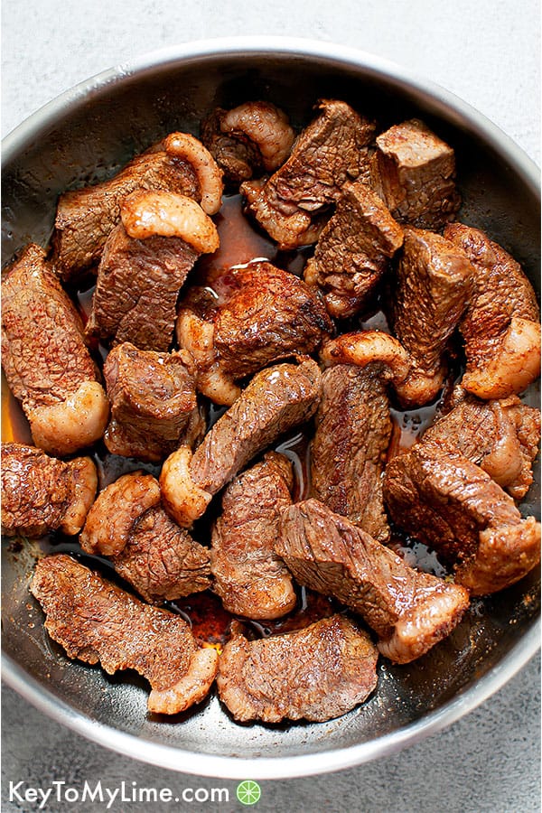 steak appetizer bites in a skillet with butter