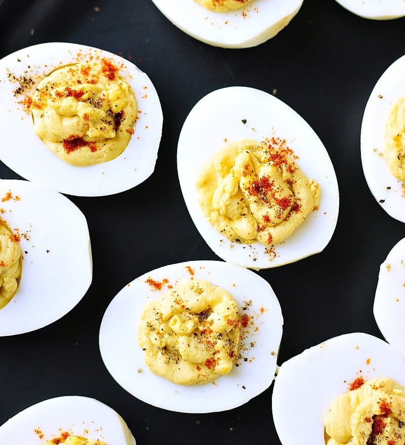deviled eggs with sriracha appetizer on a plate