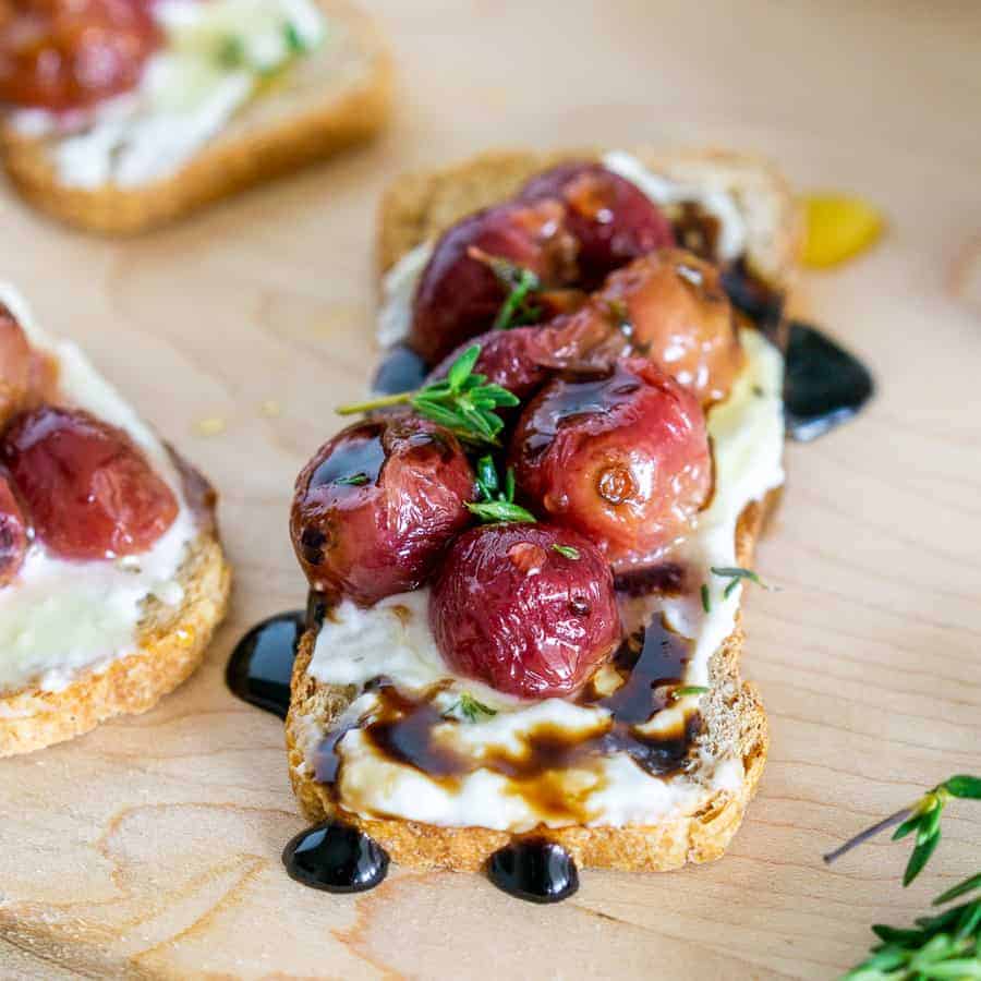 blue cheese on toast with roasted grapes and balsamic vinegar appetizer