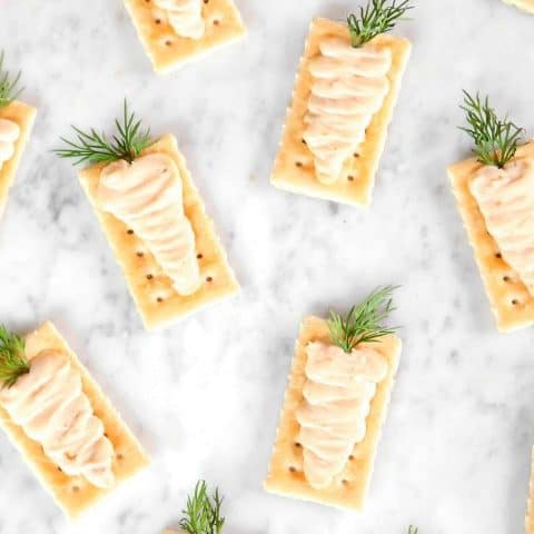 crackers with cheese piped into carrots appetizer for Easter.