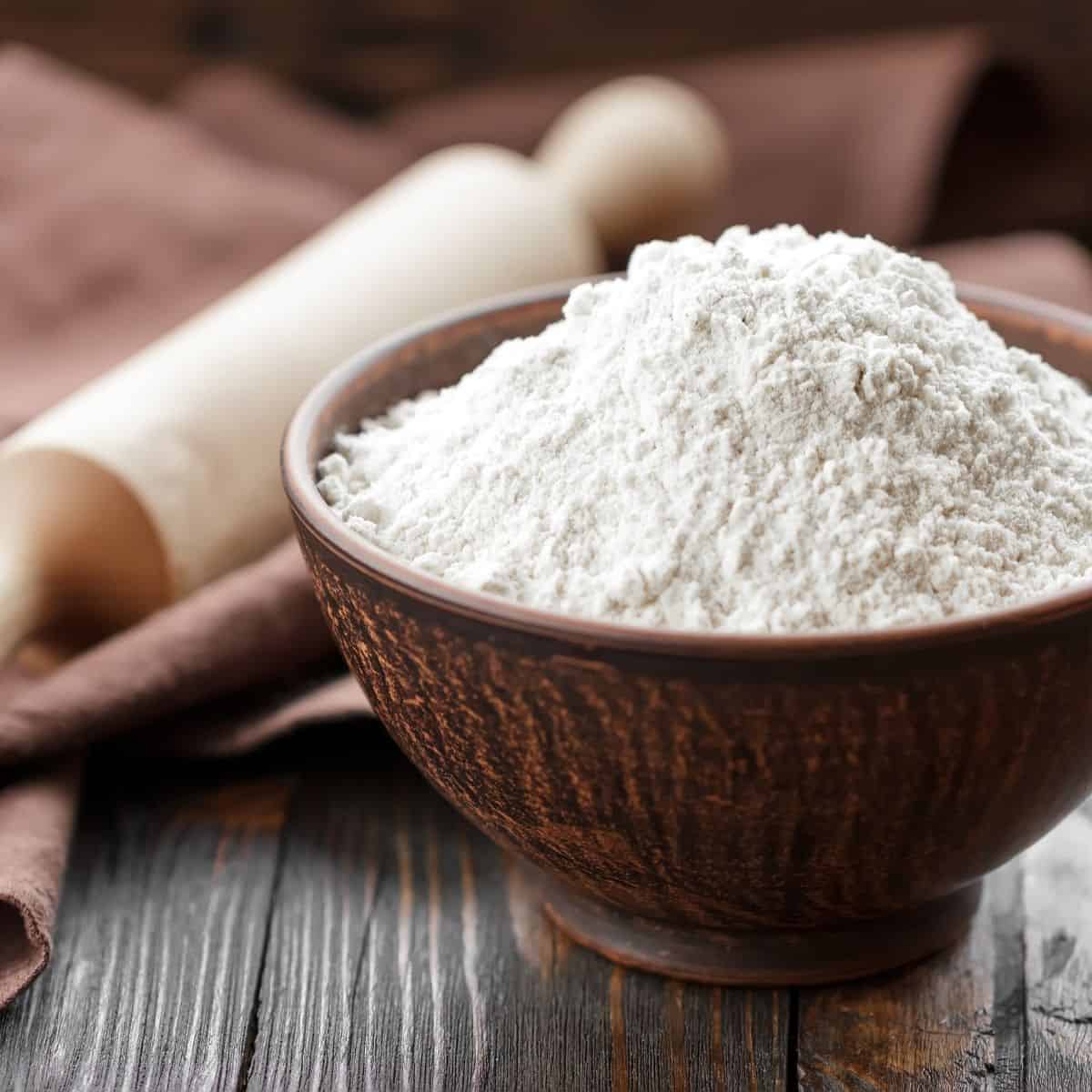 All purpose white flour in a small bowl.