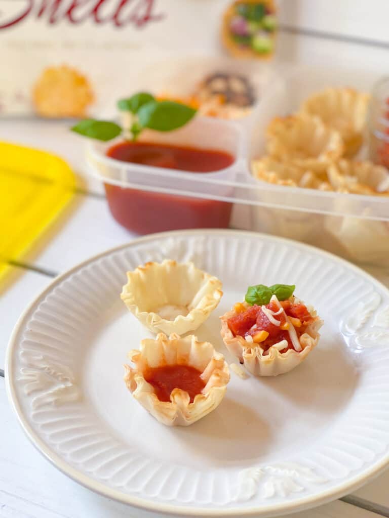 homemade pizza lunchable with phyllo cups on a plate