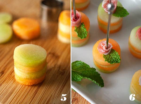 melon and ham appetizer skewers on a plate with mint leaf.