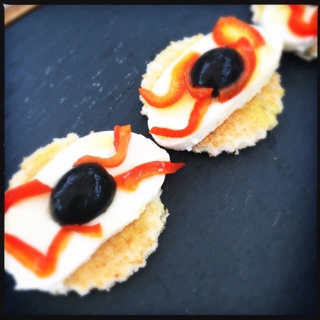 Bruschetta with spooky eye balls using olives.