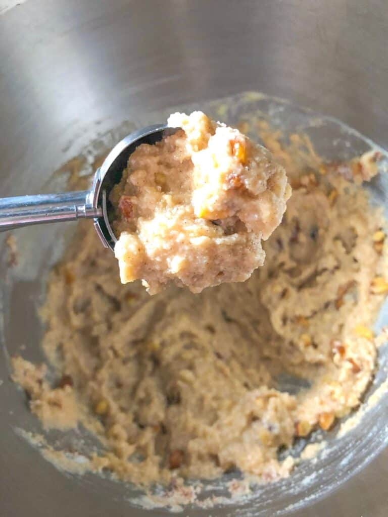 banana walnut muffin batter in an ice cream scoop
