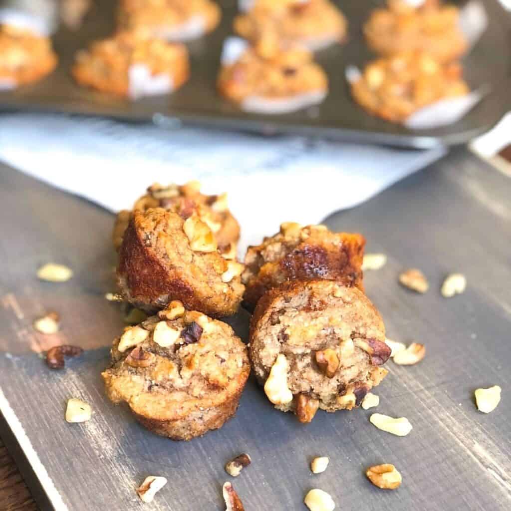 moist mini banana nut muffins on a table