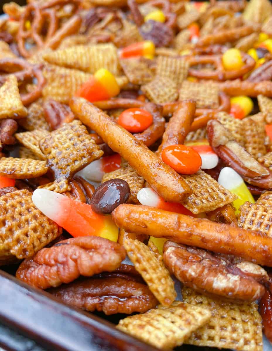 close up of fall Halloween Chex mix with candy corn.