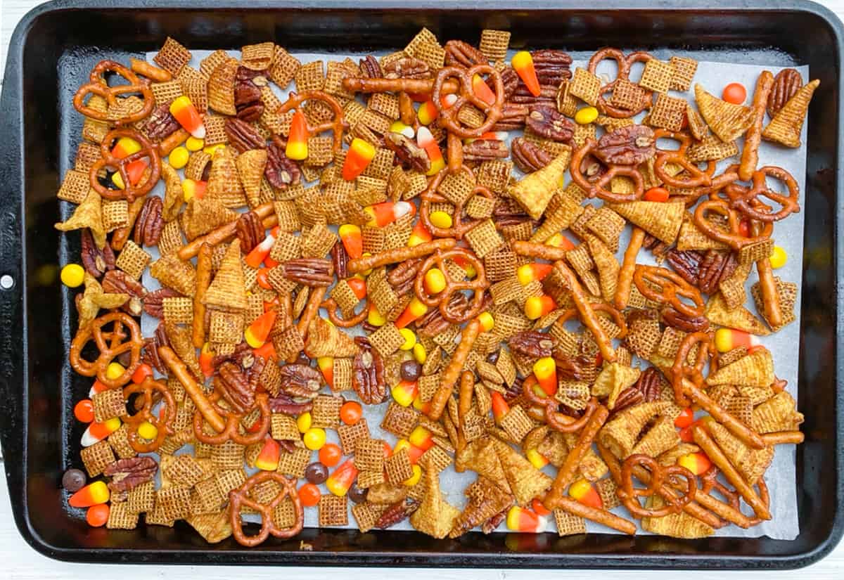 Overhead shot of chex mix on a baking sheet.