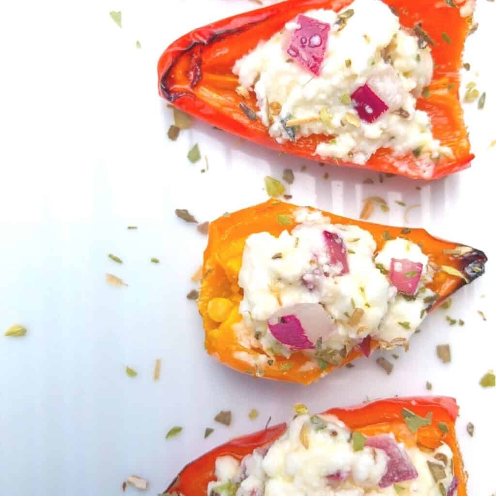 feta cheese stuffed baby bell peppers appetizer on a plate