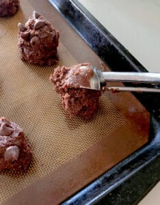 Scooping chocolate batter.