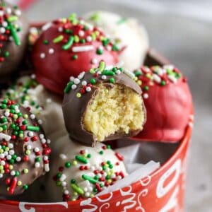 Christmas cake balls in stacked an aluminum tin.