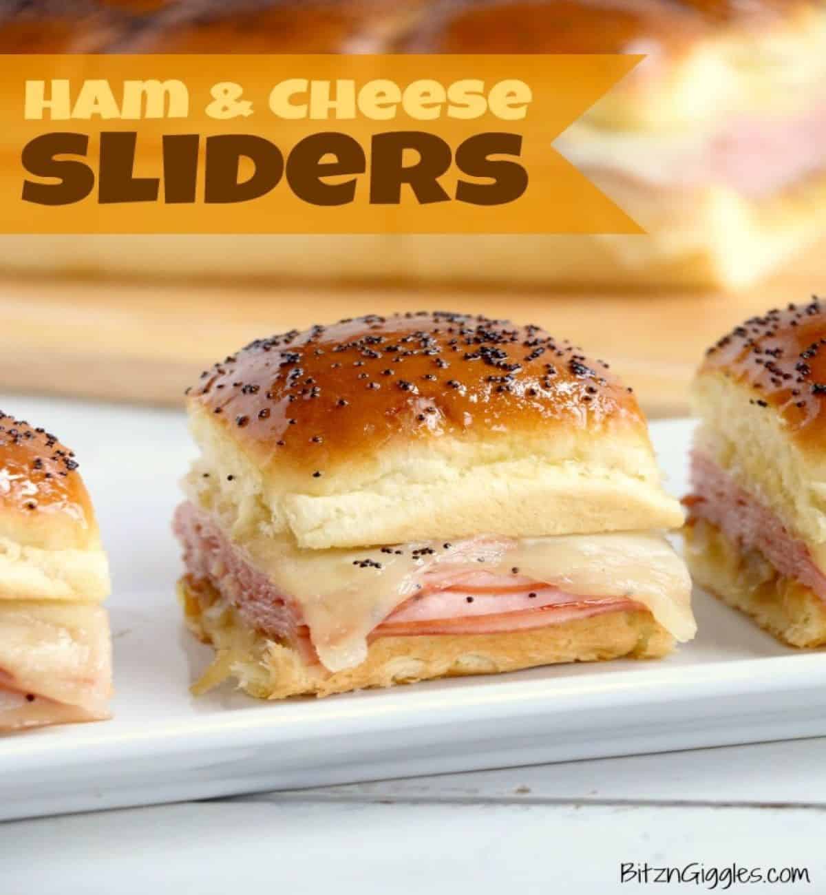 ham and cheese slider sandwiches on a plate.