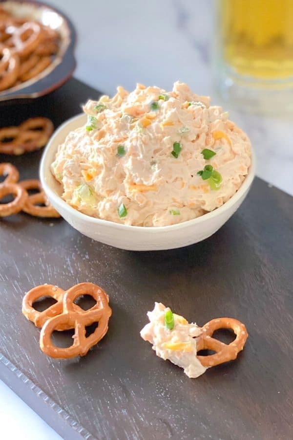 Cheesy beer pretzel dip in a bowl.