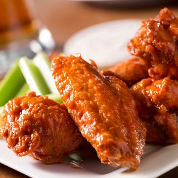 Buffalo wings on a plate for game day.