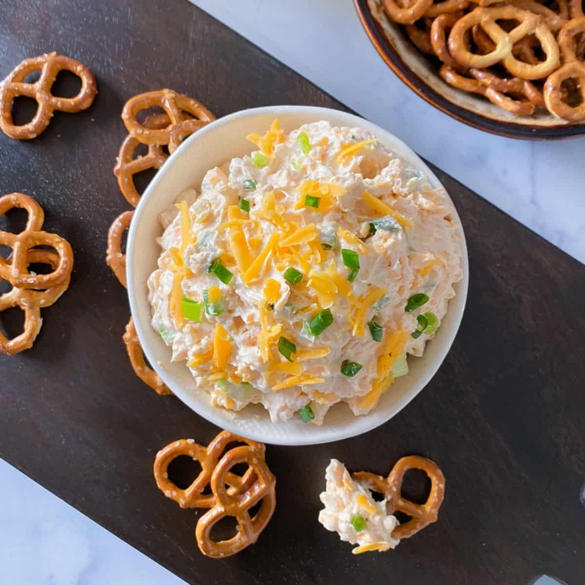 overhead shot of cheddar cheese beer dip for hard pretzels.