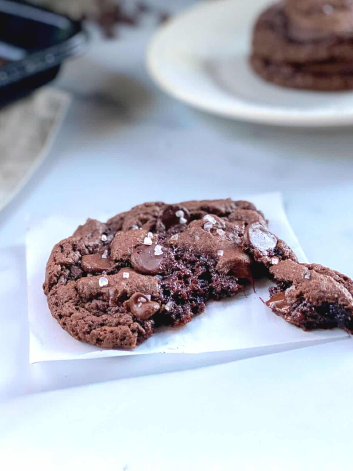 Chocolate chip devils cake mix cookie on plate ripped open.