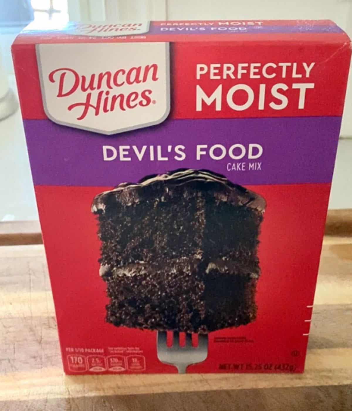 box of duncan hines moist devil's food chocolate cake mix on counter.