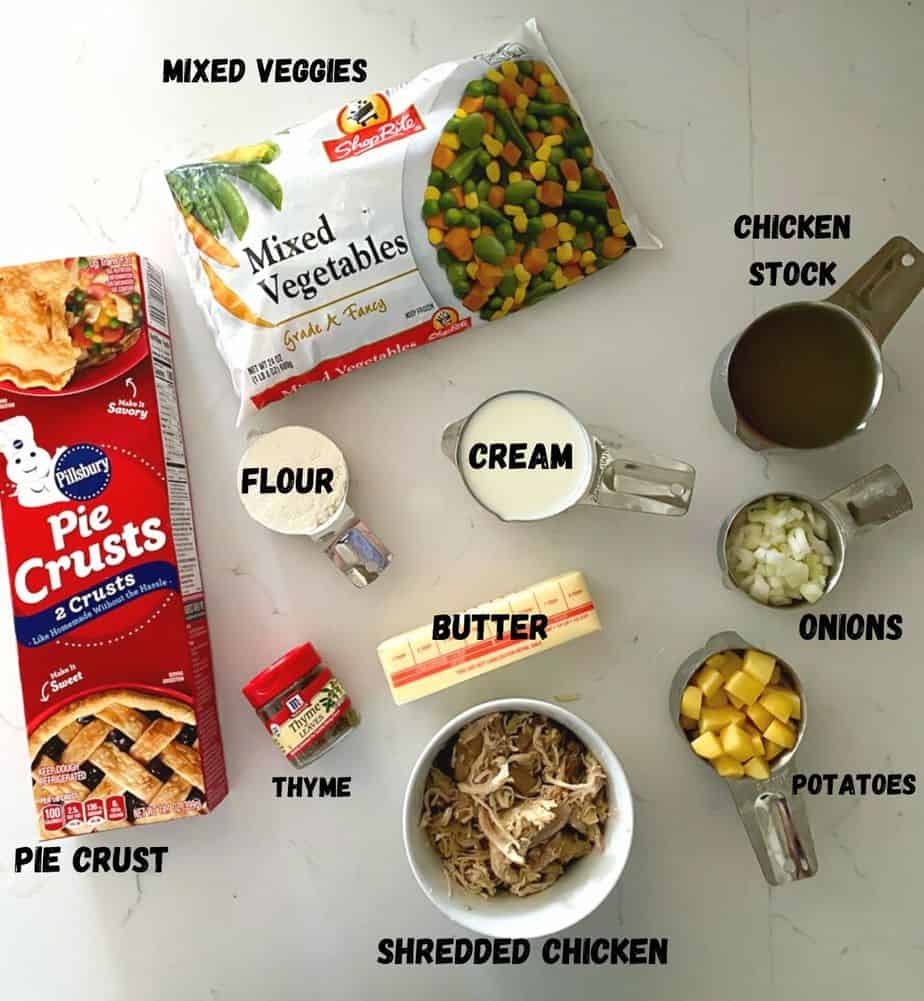 Ingredients used to make chicken pot pie on a table.