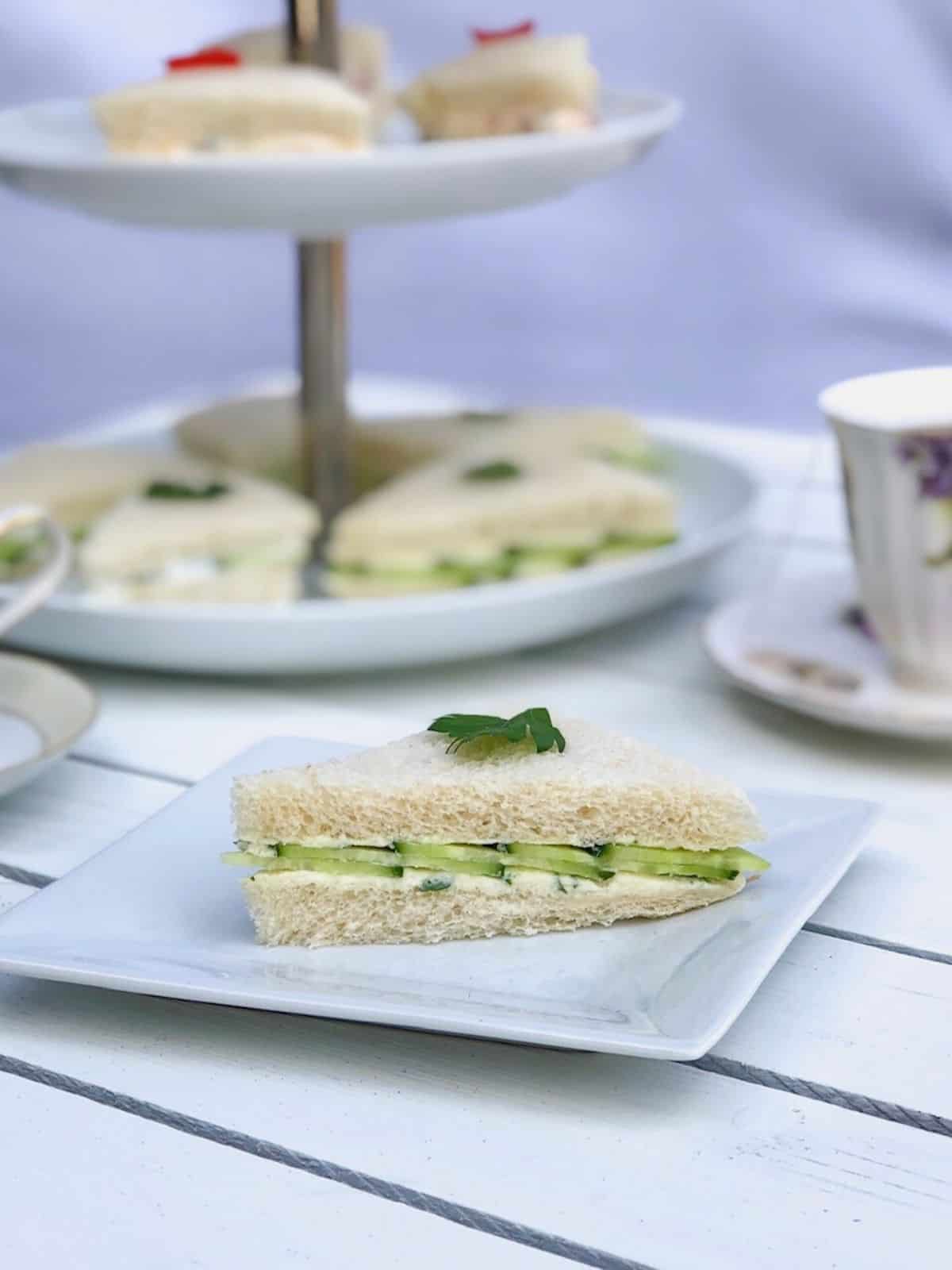 English tea cucumber finger sandwiches on a plate.